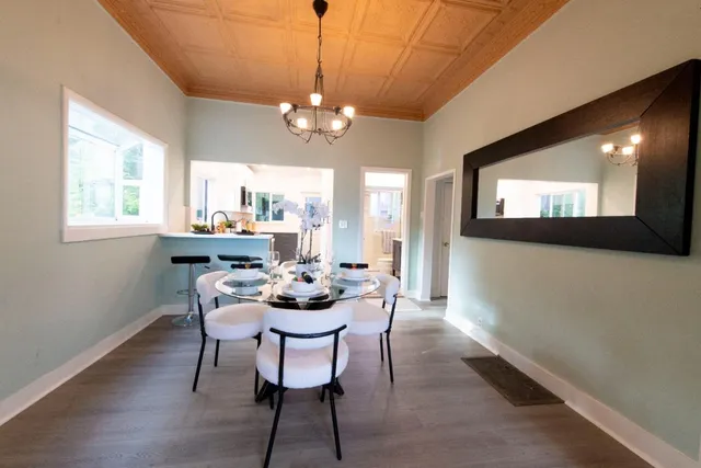 a view of a dining room with furniture window and outside view