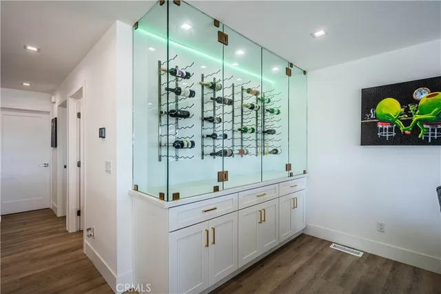 a kitchen with kitchen island a table and chairs