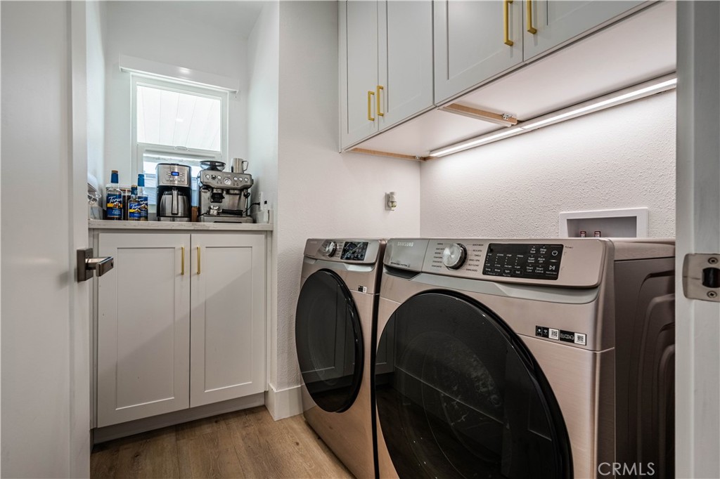 1120 East Mission Road, Unit 102 Fallbrook, CA 92028 - Photo 32 of 62 a utility room with dryer and washer