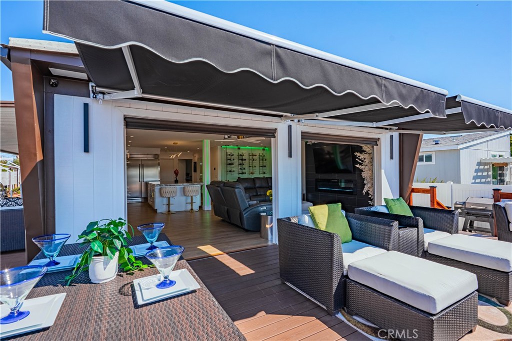 1120 East Mission Road, Unit 102 Fallbrook, CA 92028 - Photo 39 of 62 a view of a patio with couches table and chairs and potted plants