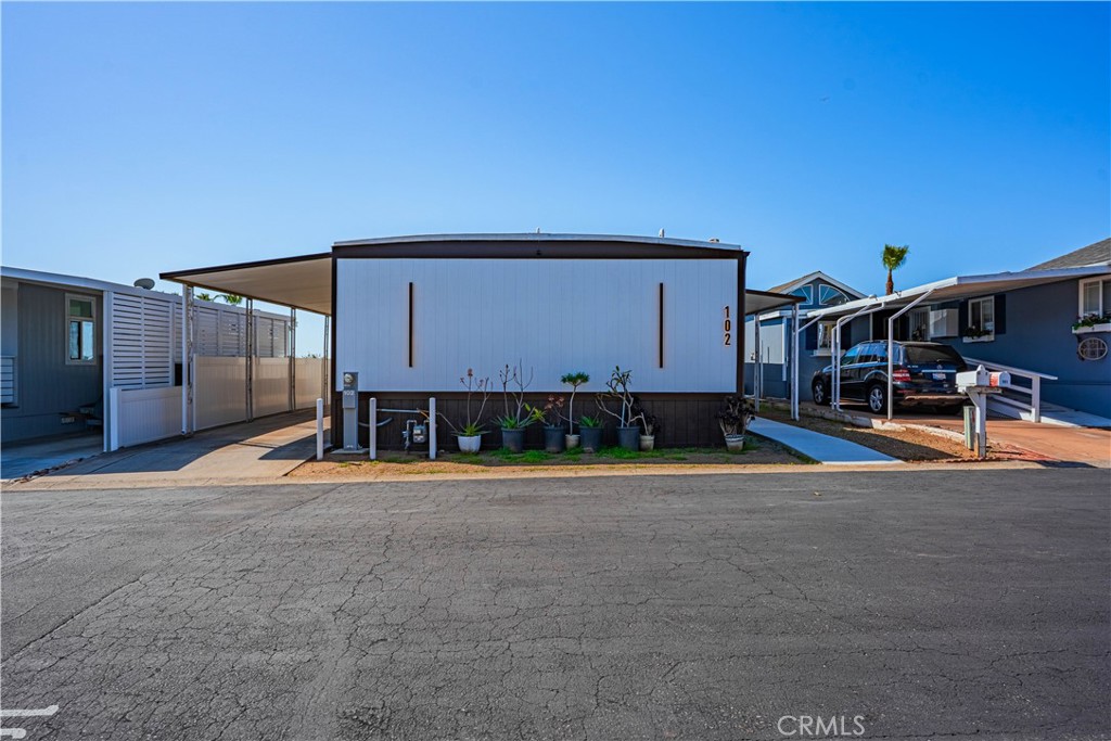 1120 East Mission Road, Unit 102 Fallbrook, CA 92028 - Photo 54 of 62 a view of a building with a patio