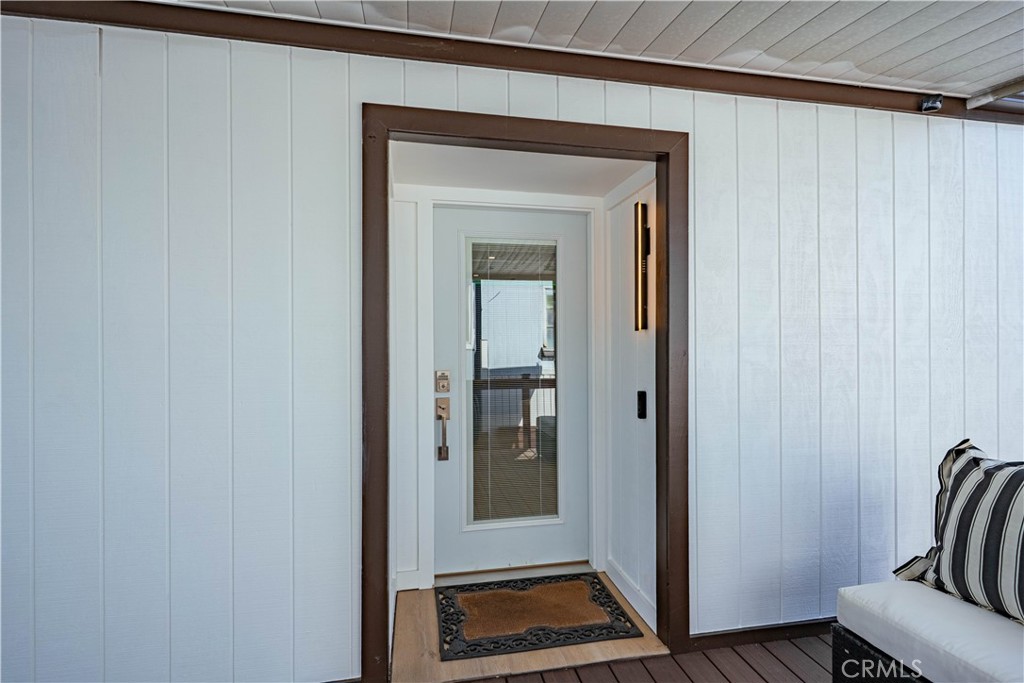 1120 East Mission Road, Unit 102 Fallbrook, CA 92028 - Photo 9 of 62 a view of front door with a mirror