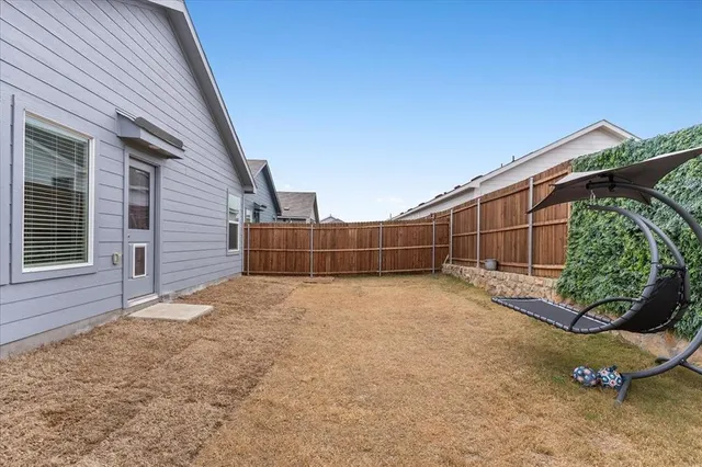 a view of backyard and entertaining space