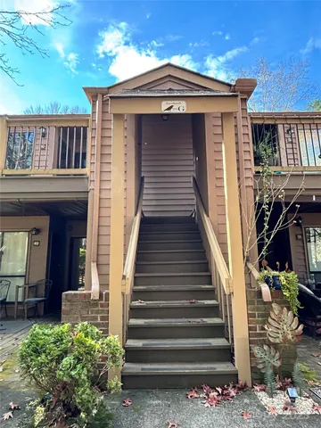 a view of a brick house with a large window