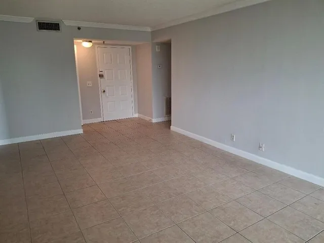 a view of an empty room and window