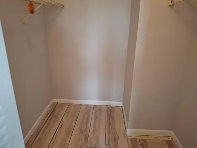 a white toilet sitting next to a bathroom sink