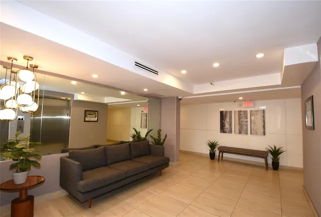 a view of a swimming pool with a yard