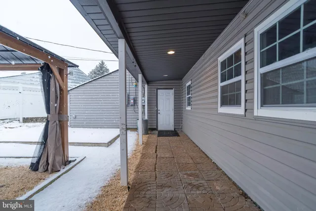 a view of backyard with large windows
