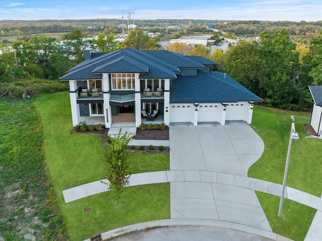 a dining room with furniture entryway and wooden floor