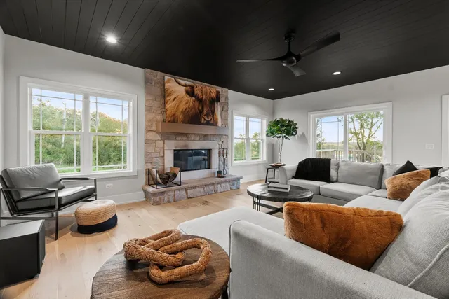 a kitchen with kitchen island granite countertop a sink stainless steel appliances and cabinets