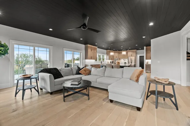 a kitchen with stainless steel appliances granite countertop a sink a microwave and wooden cabinets