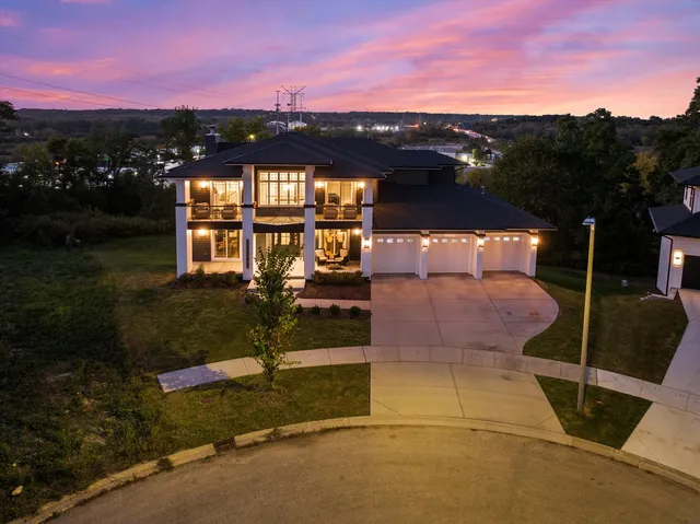 a balcony view with couple of chairs and wooden floor