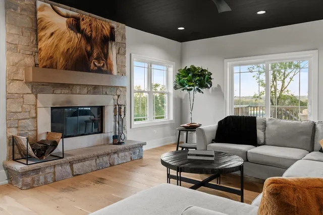a kitchen with white cabinets and sink