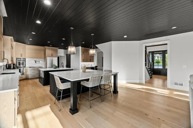 a bedroom with bed and a large window