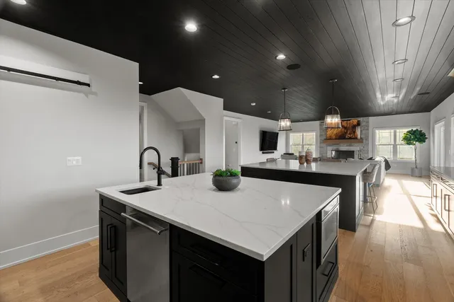 a bathroom with double vanity sink and a mirror