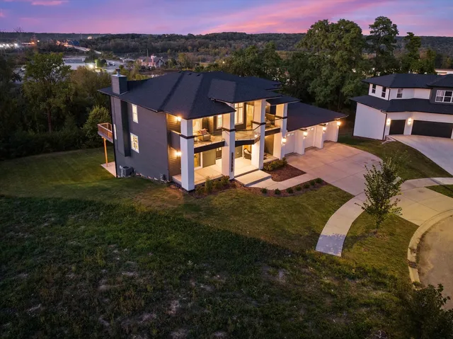 a balcony with wooden floor and city view