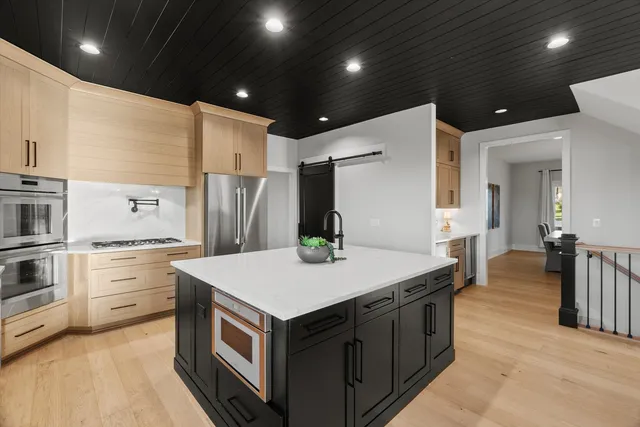 a balcony with furniture and a large window