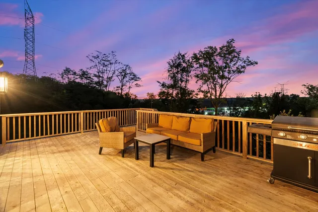 a view of a two chairs in the balcony