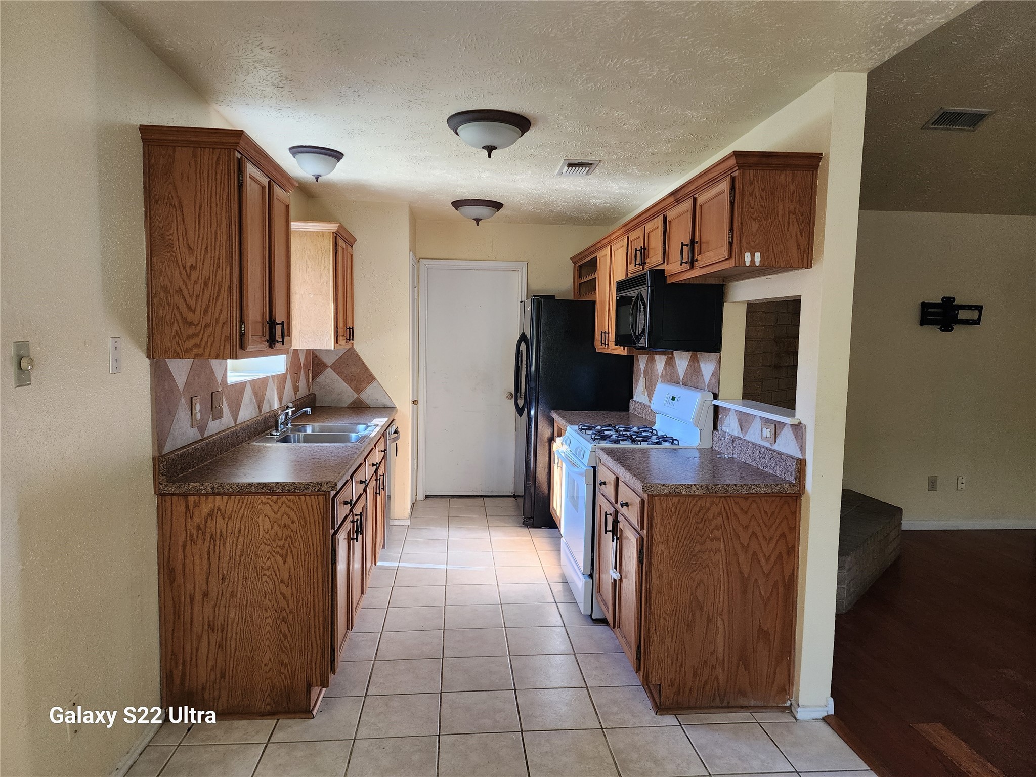 2810 Goldspring Lane Spring, TX 77373 - Photo 5 of 8 a kitchen with kitchen island cabinets and counter space