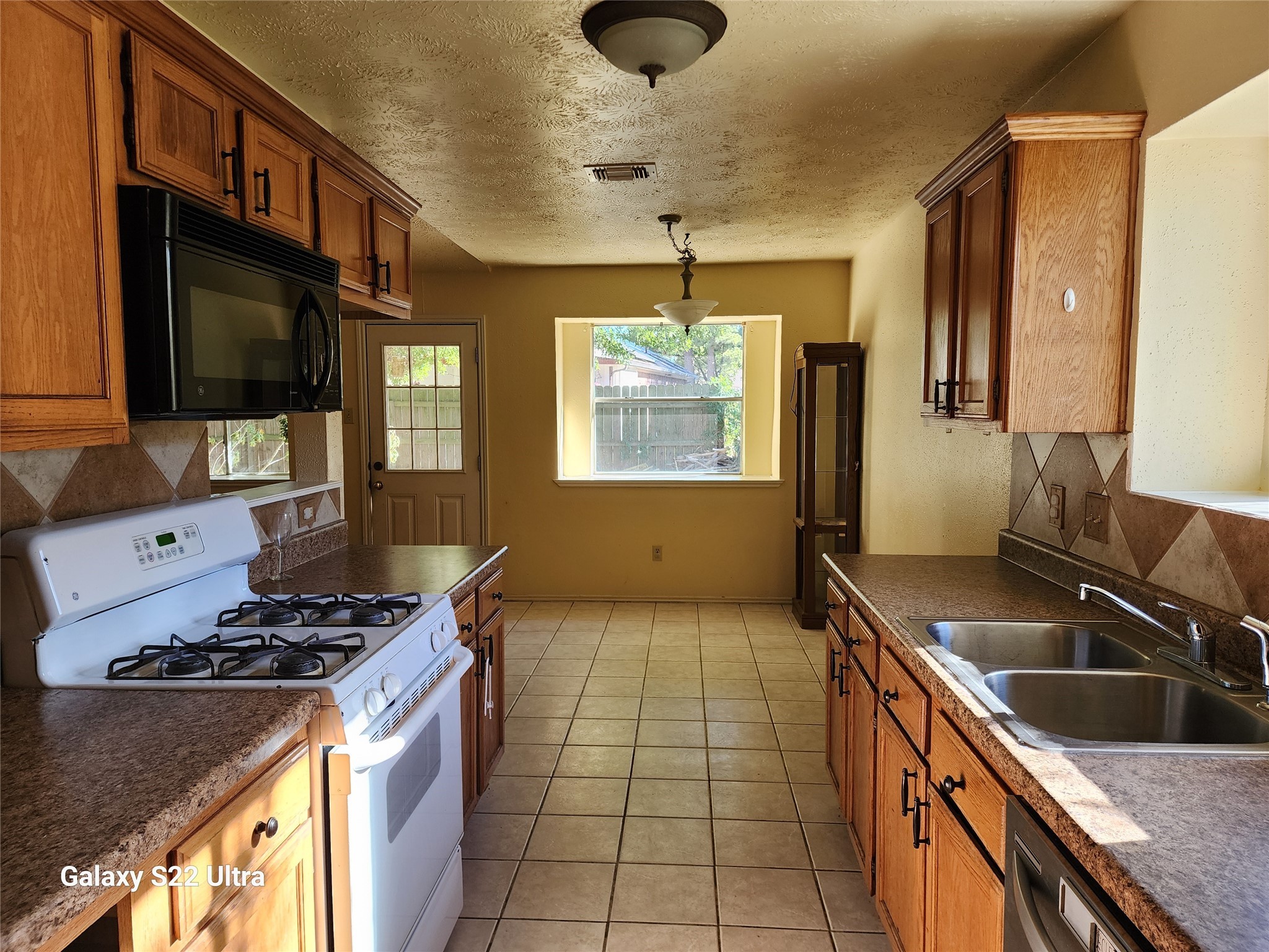 2810 Goldspring Lane Spring, TX 77373 - Photo 8 of 8 a kitchen that has a sink and a stove