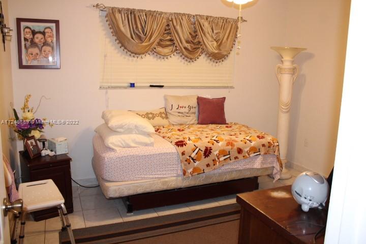 Hialeah Hialeah, FL 33018 - Photo 12 of 18 a bedroom with a bed and with furniture