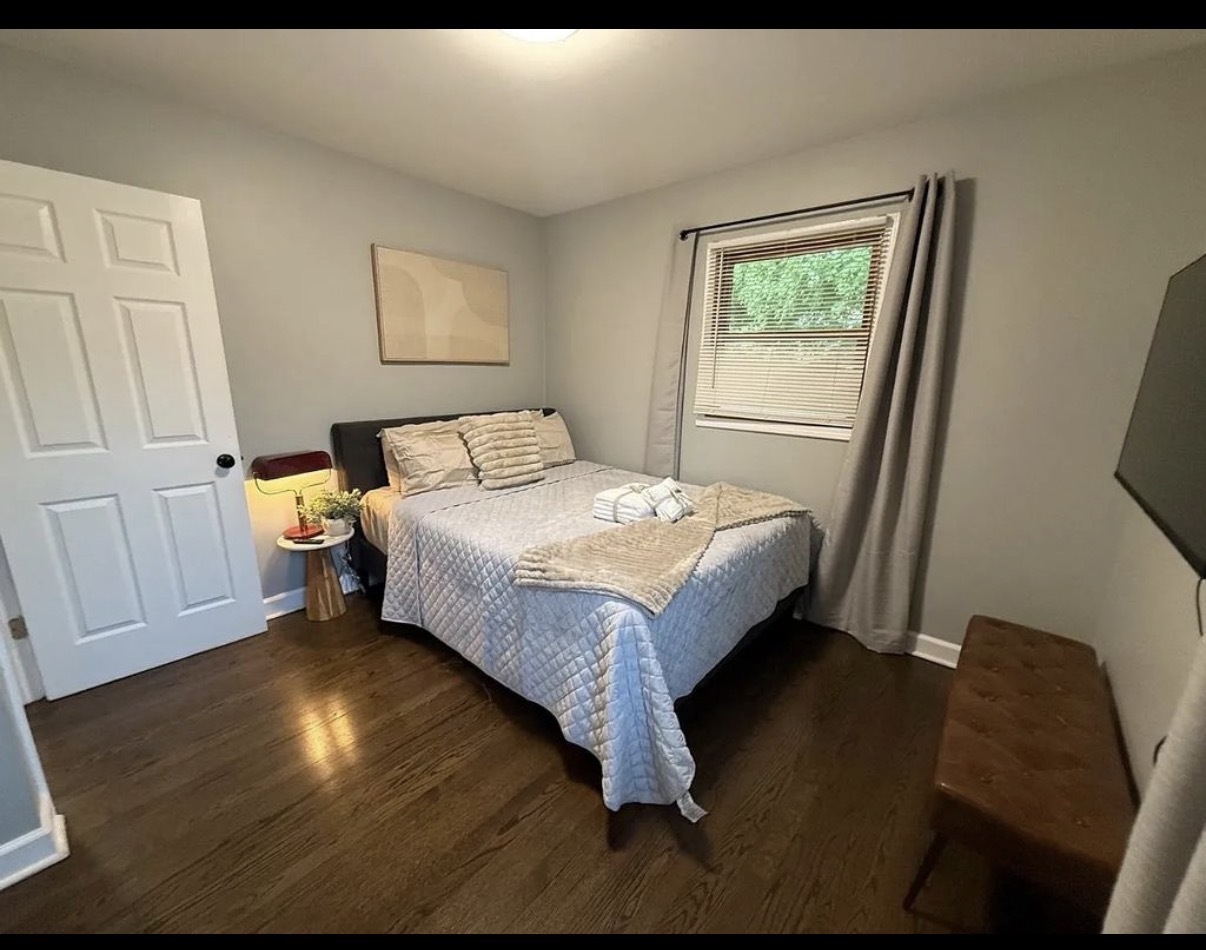 436 Springhill Drive Roselle, IL 60172 - Photo 3 of 11 a bed sitting in a bedroom next to a window