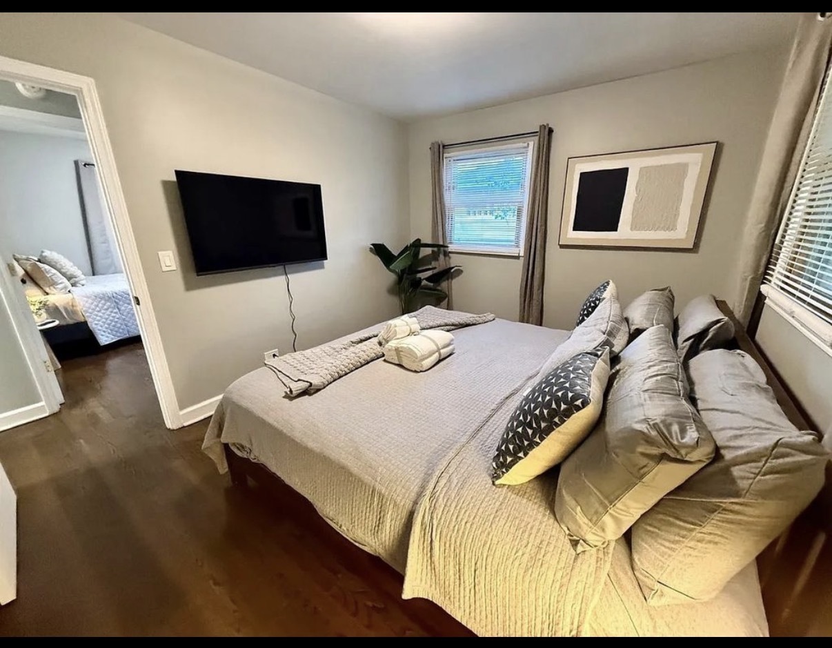 436 Springhill Drive Roselle, IL 60172 - Photo 7 of 11 a bedroom with a bed and a flat screen tv