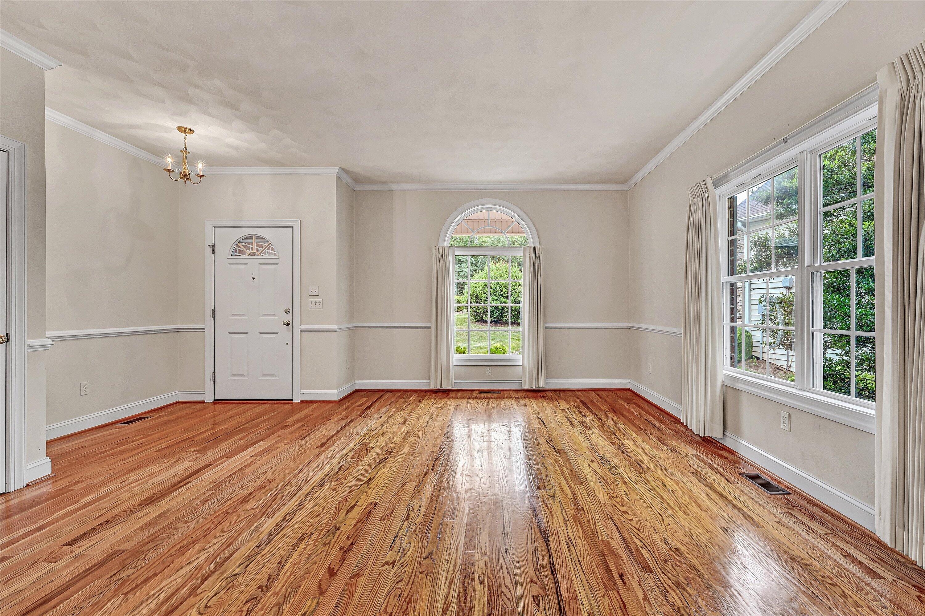 131 Stoney Mill Road Rocky Mount, VA 24151 - Photo 6 of 37 a view of empty room with wooden floor and fan