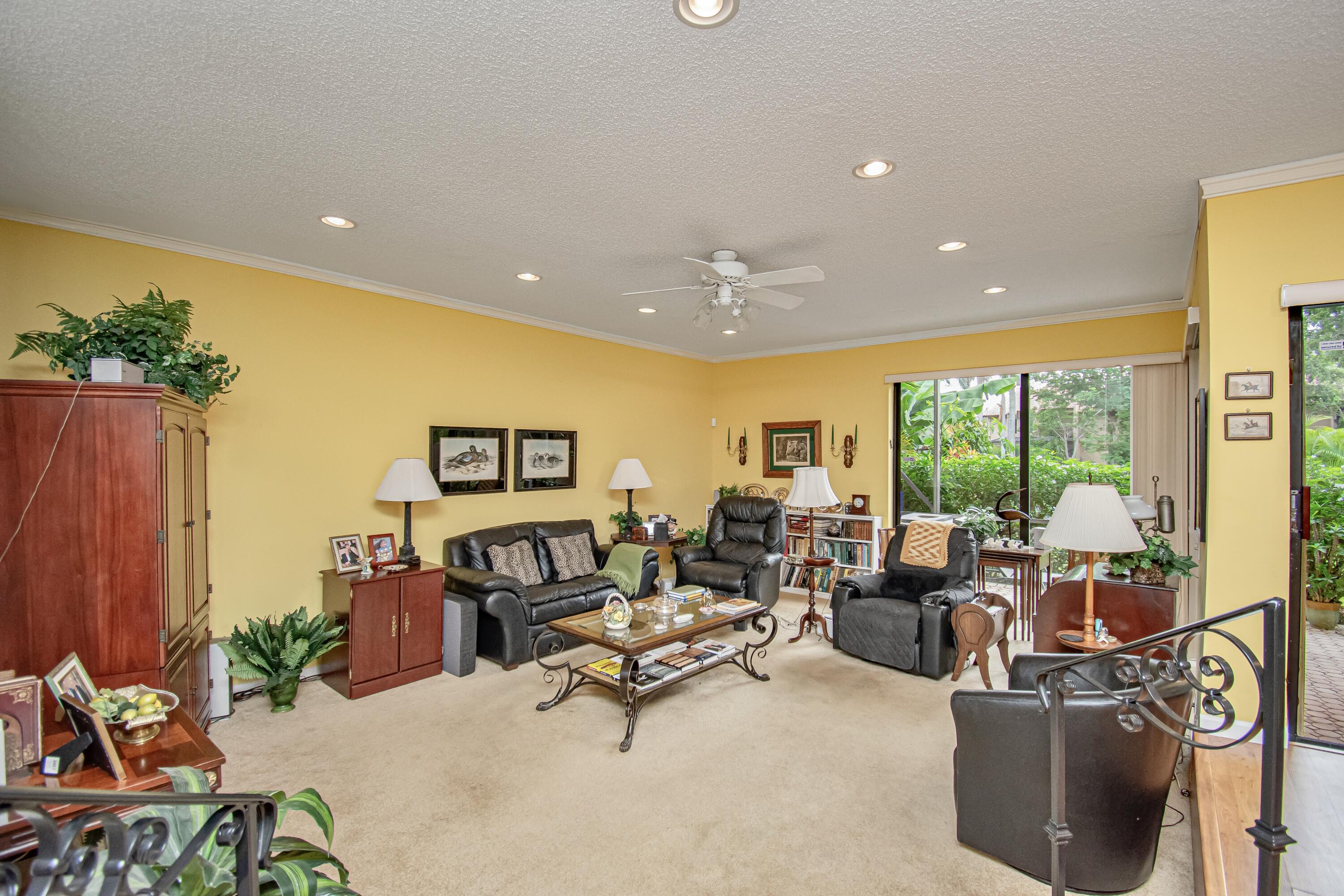 22066 Las Brisas Circle Boca Raton, FL 33433 - Photo 15 of 45 a living room with furniture and a flat screen tv