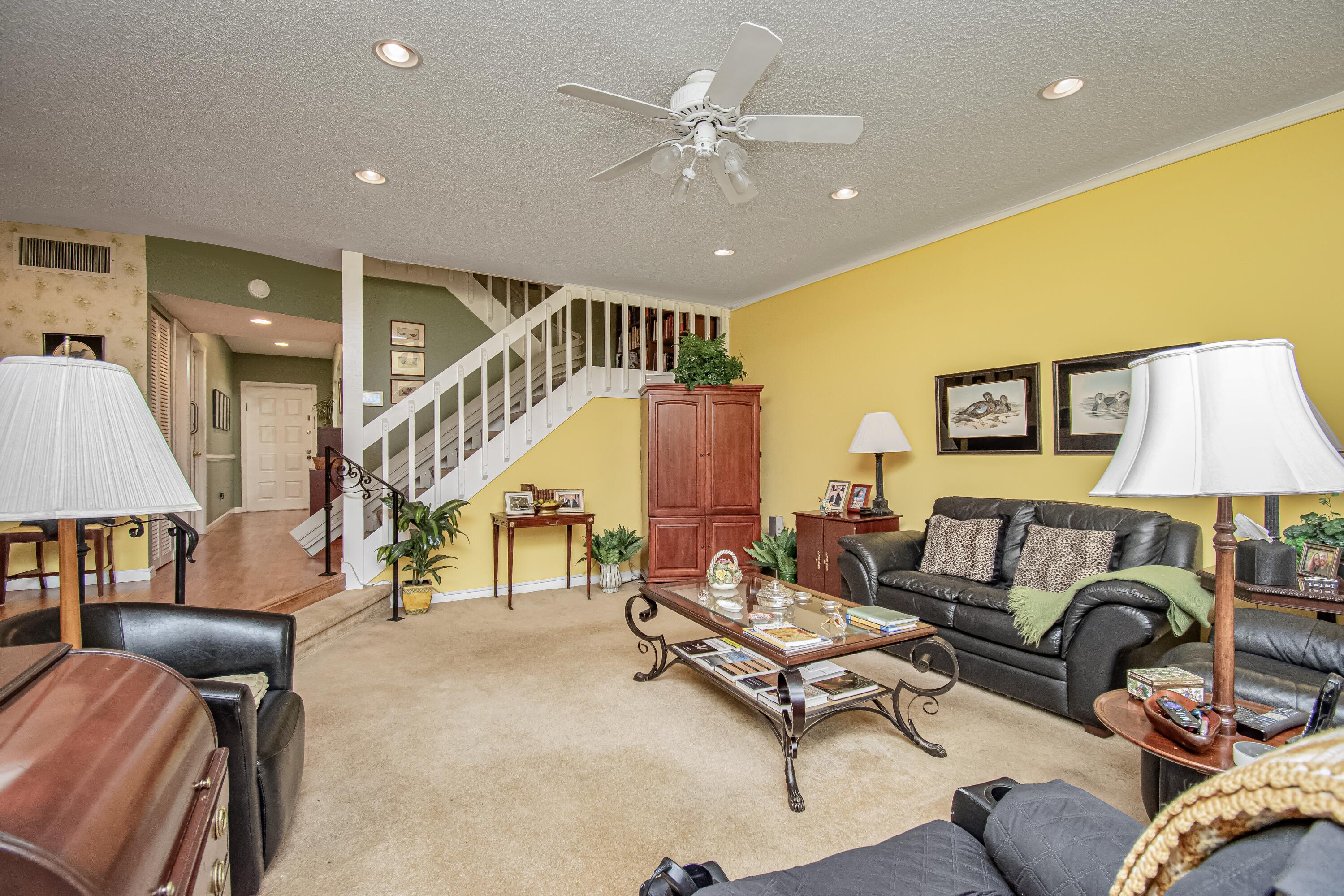 22066 Las Brisas Circle Boca Raton, FL 33433 - Photo 17 of 45 a living room with furniture and a ceiling fan