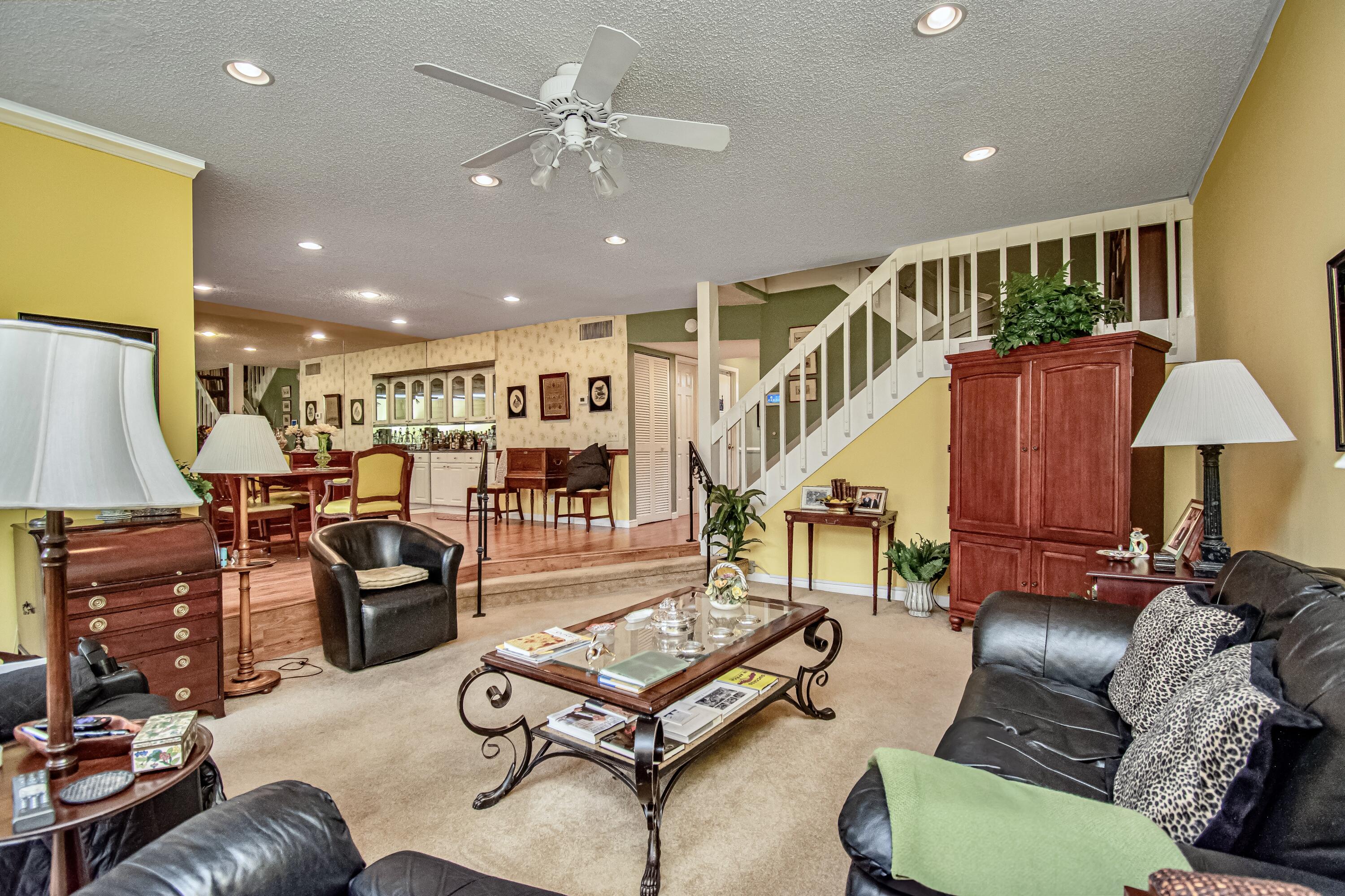 22066 Las Brisas Circle Boca Raton, FL 33433 - Photo 18 of 45 a living room with furniture kitchen view and a wooden floor