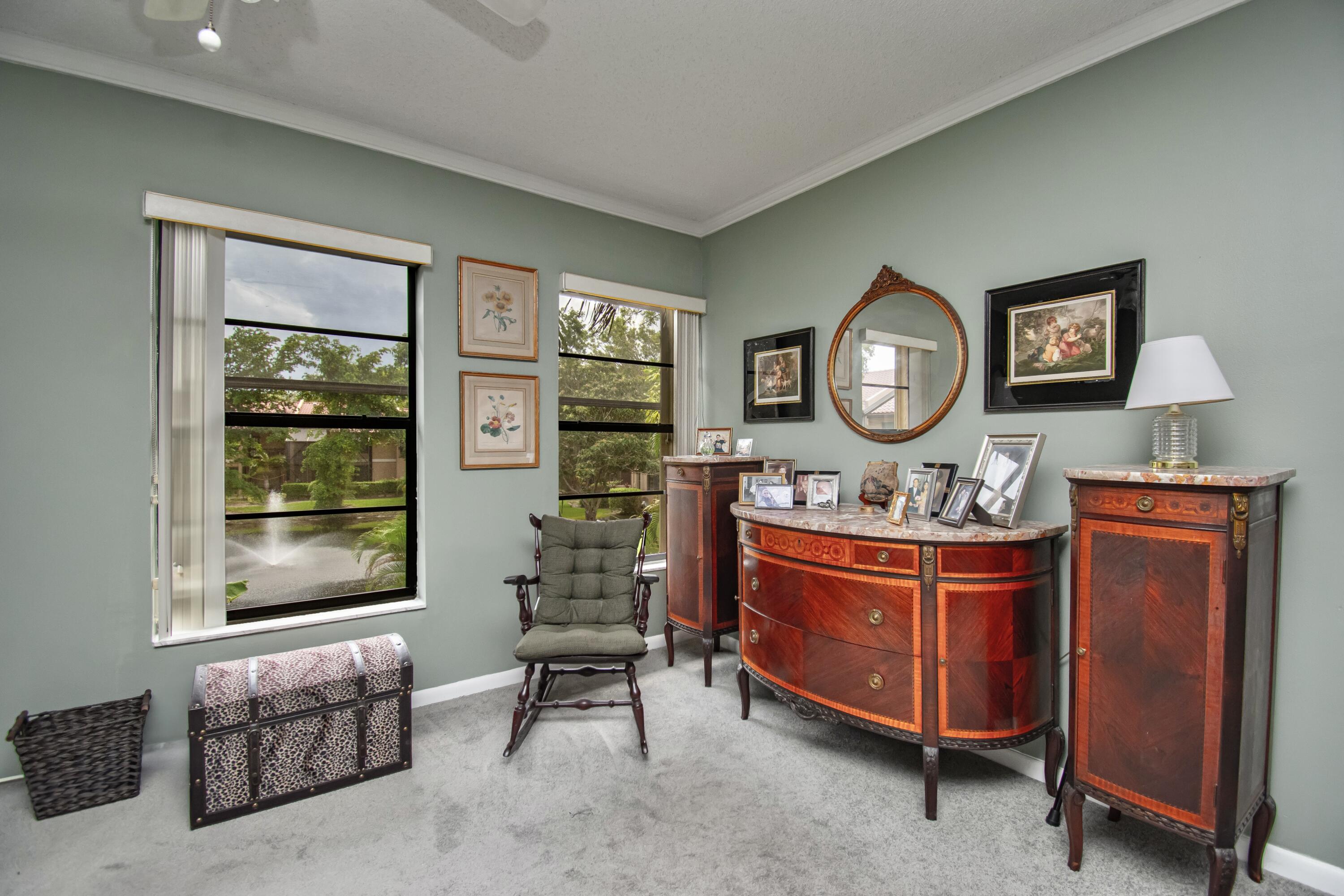 22066 Las Brisas Circle Boca Raton, FL 33433 - Photo 24 of 45 a living room with furniture and a window
