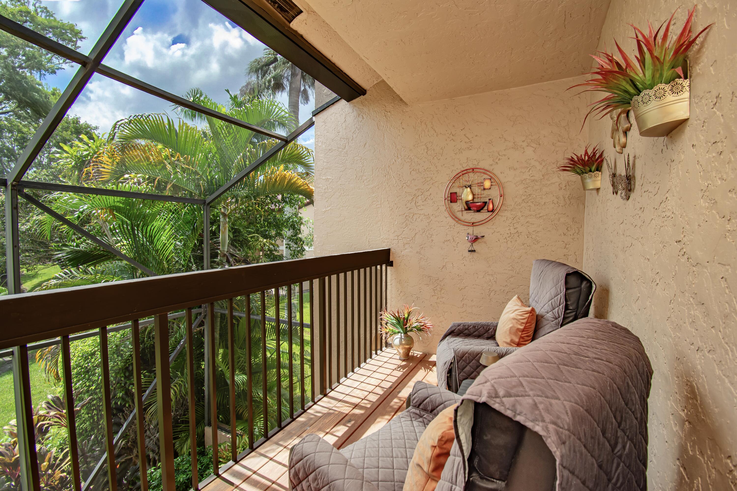 22066 Las Brisas Circle Boca Raton, FL 33433 - Photo 29 of 45 a view of balcony with furniture