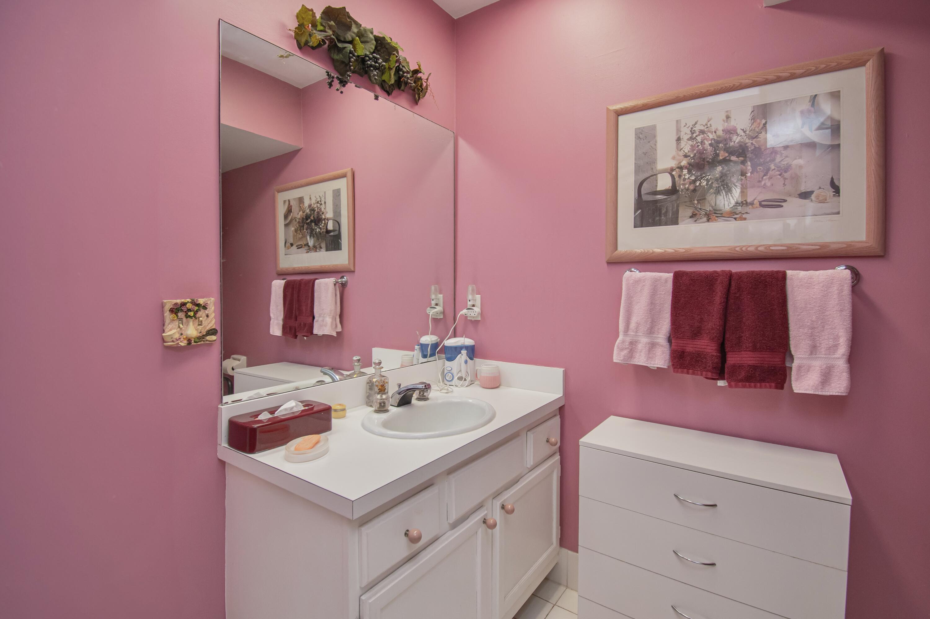 22066 Las Brisas Circle Boca Raton, FL 33433 - Photo 32 of 45 a bathroom with a sink vanity and a mirror