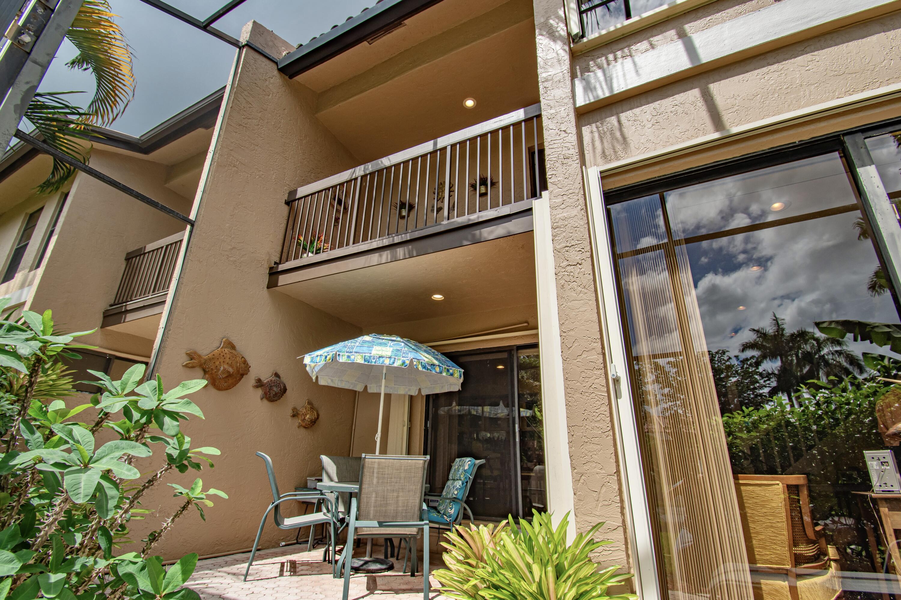 22066 Las Brisas Circle Boca Raton, FL 33433 - Photo 38 of 45 a front view of a house with a porch
