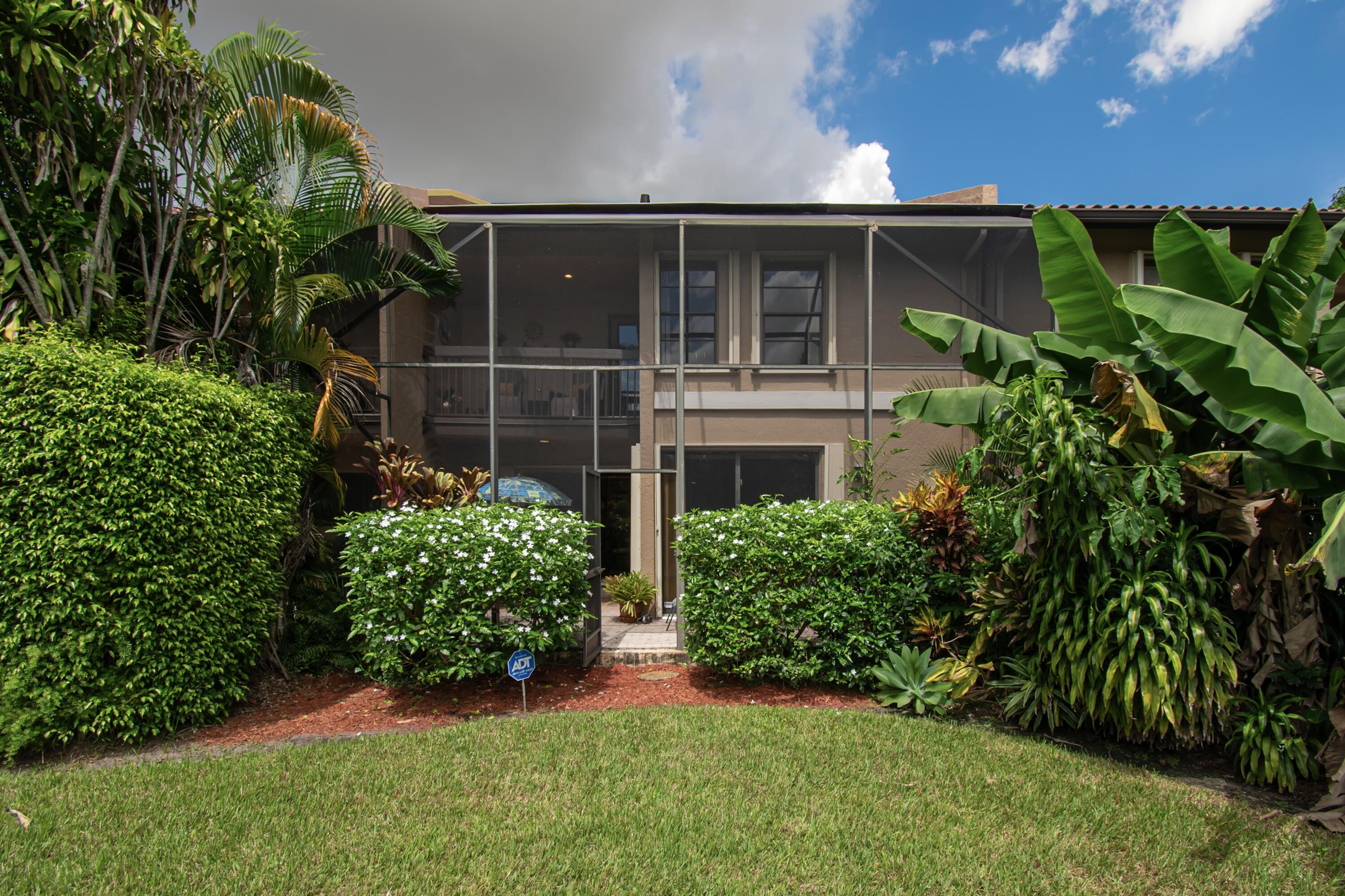 22066 Las Brisas Circle Boca Raton, FL 33433 - Photo 42 of 45 a front view of a house with a yard