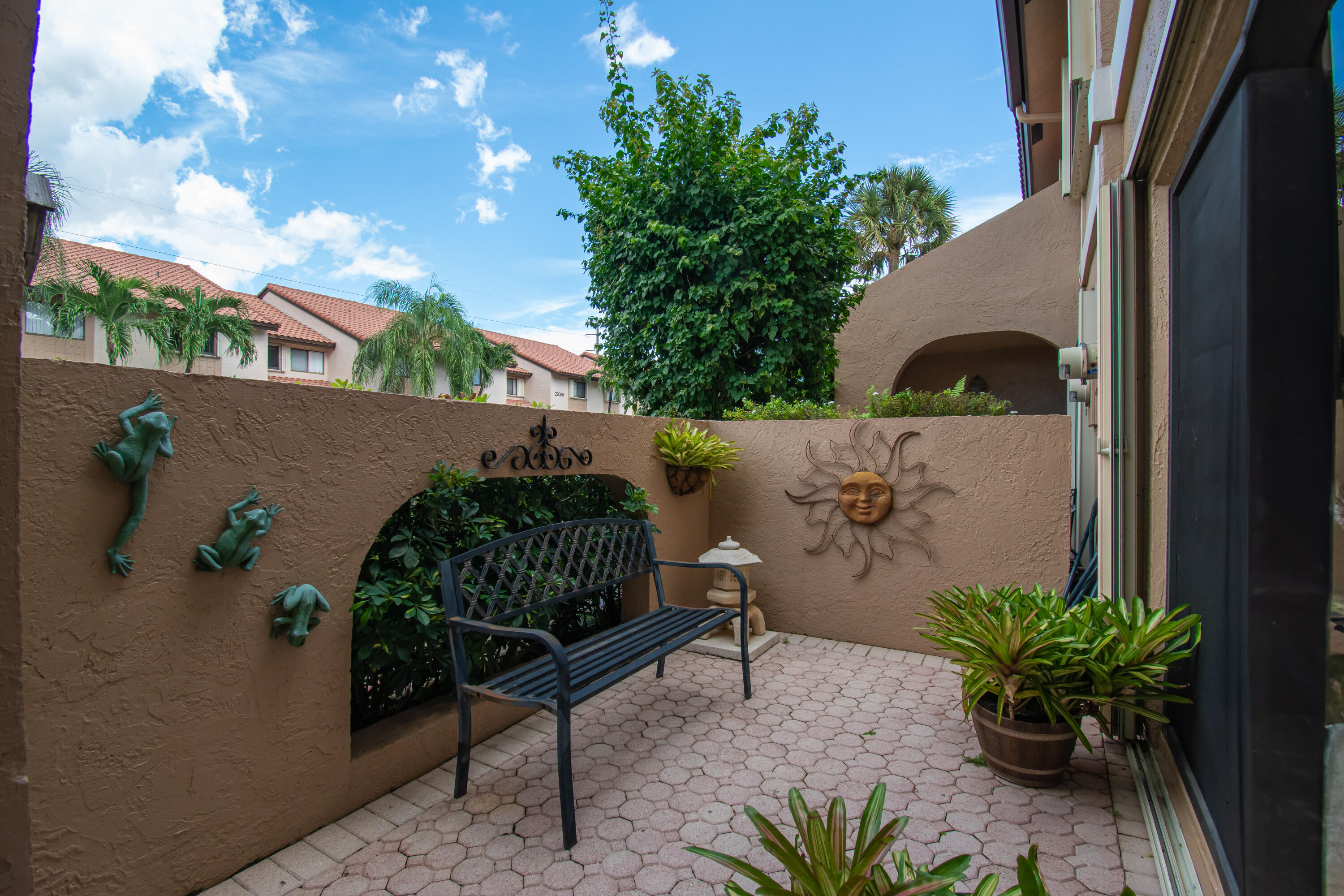 22066 Las Brisas Circle Boca Raton, FL 33433 - Photo 7 of 45 a backyard of a house with lots of green space