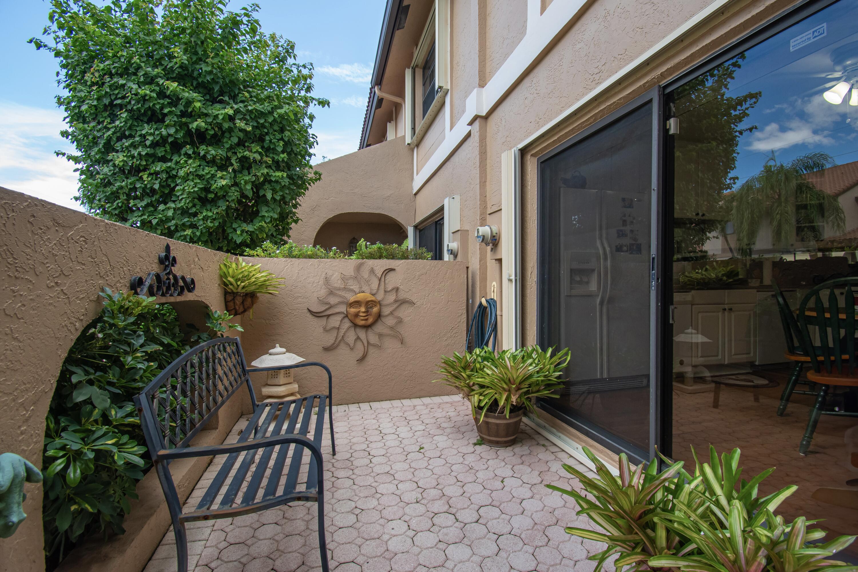 22066 Las Brisas Circle Boca Raton, FL 33433 - Photo 8 of 45 a view of balcony with furniture and potted plants