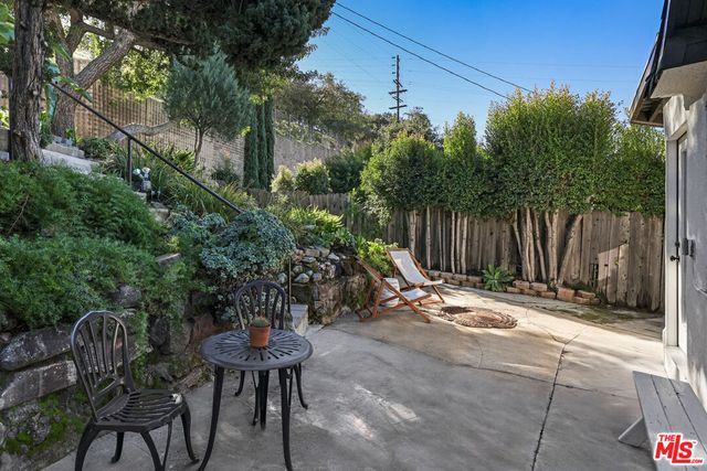 front view of a house with a garden