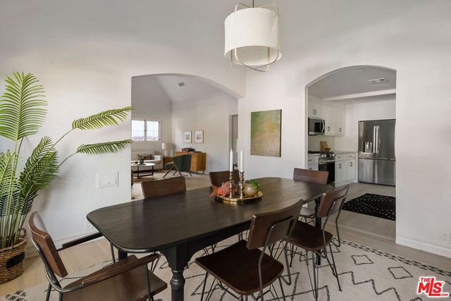a kitchen with sink stove and cabinets