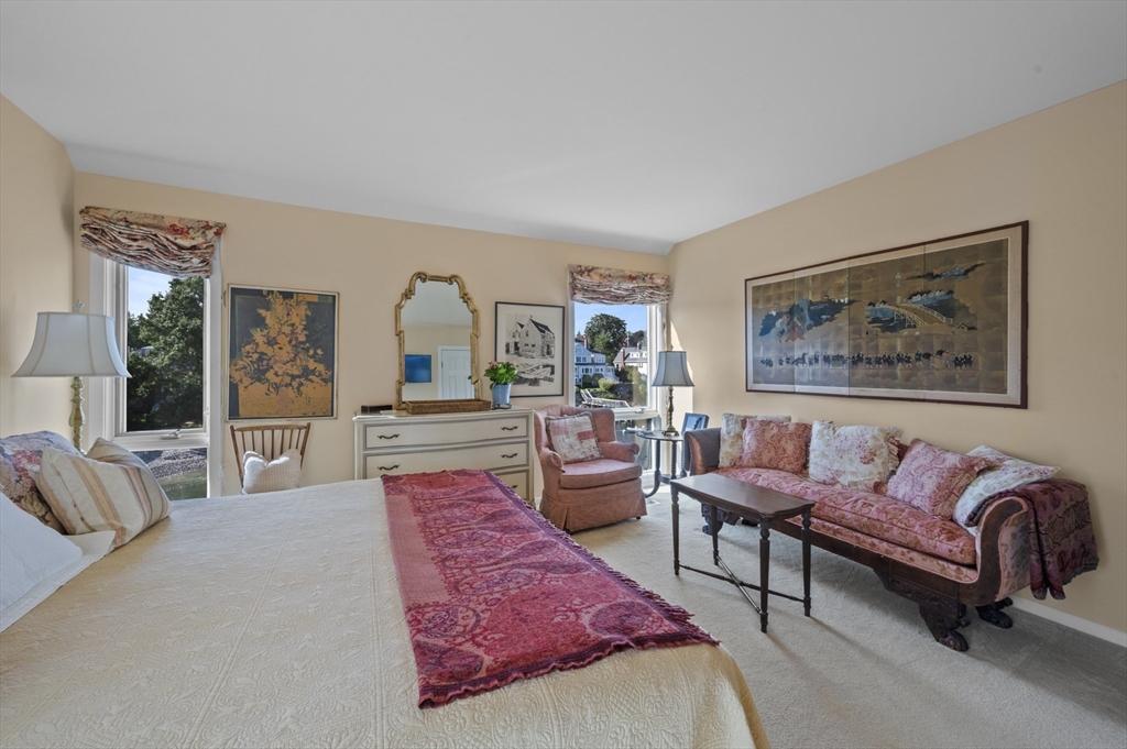 9 Skinner's Path, Unit 9 Marblehead, MA 01945 - Photo 12 of 23 a living room with furniture and a flat screen tv