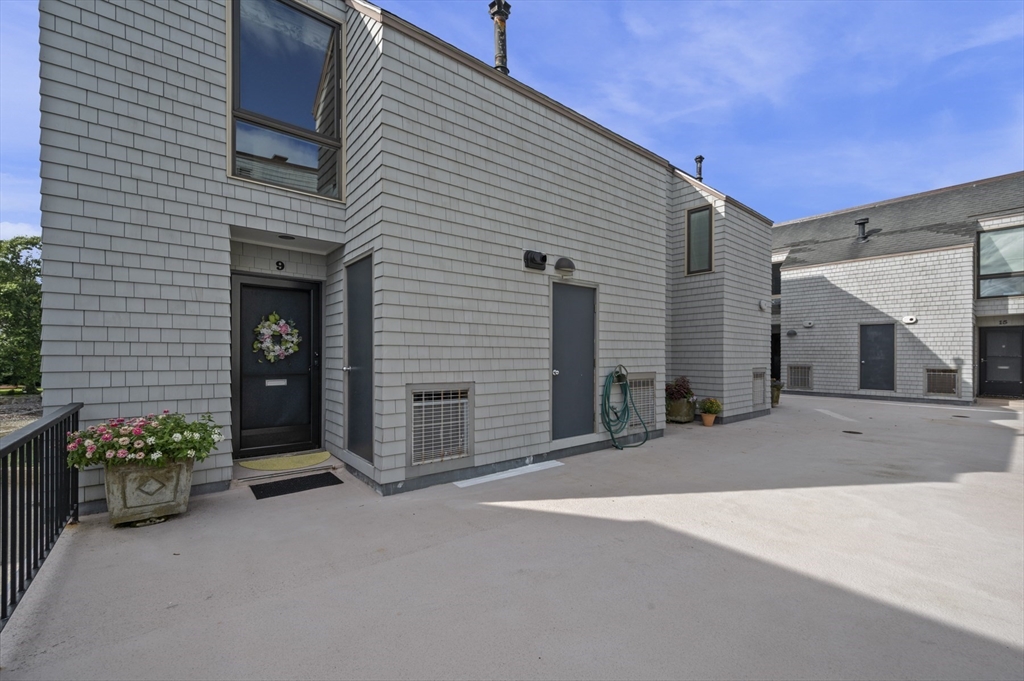 9 Skinner's Path, Unit 9 Marblehead, MA 01945 - Photo 20 of 23 a view of a house with a patio