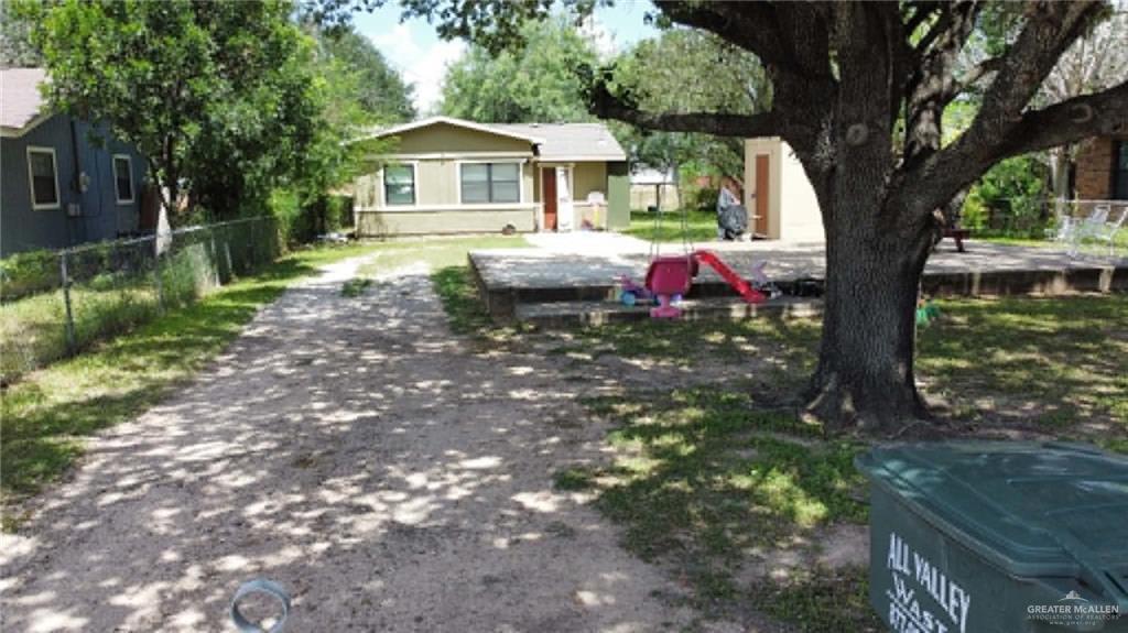 1104 Esperanza Road Alamo, TX 78516 - Photo 3 of 21 a front view of a house with yard and trees
