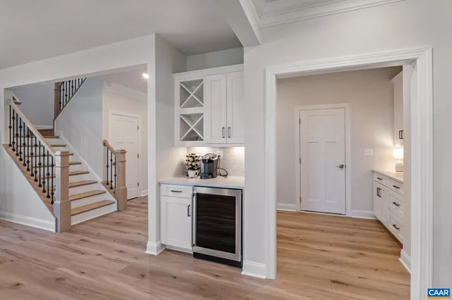 a kitchen with a stove cabinets and wooden floor