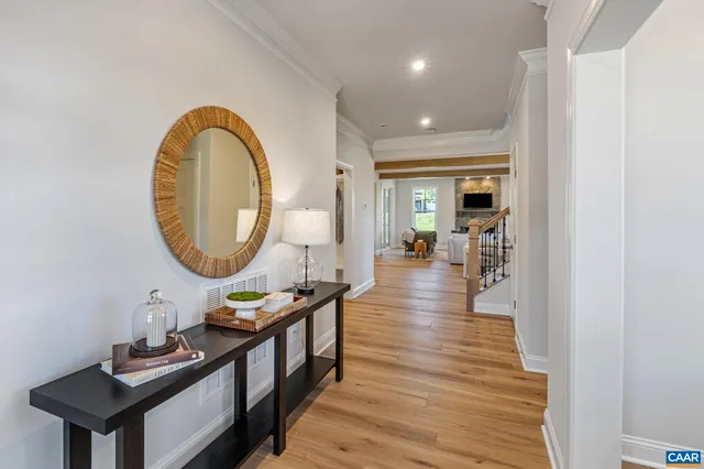 a front view of a house with wooden floor swimming pool and outdoor seating