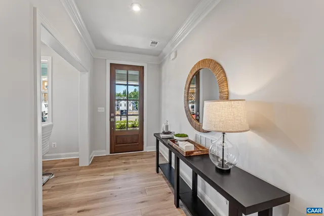 a living room with furniture a lamp and a window