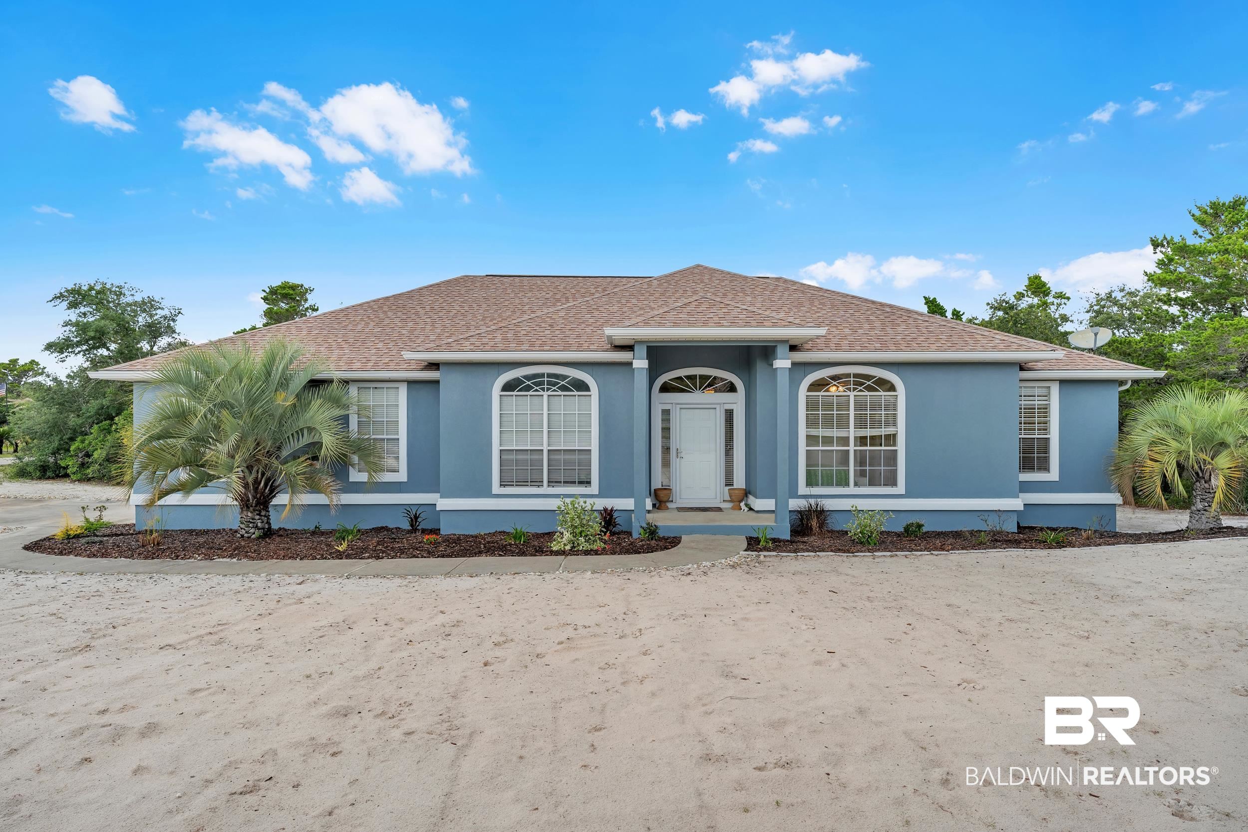 4606 Osprey Drive Orange Beach, AL 36561 - Photo 1 of 44 View of front of property with stucco siding and a shingled roof