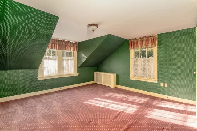 a view of an empty room with windows