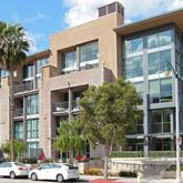 a city street lined with tall buildings