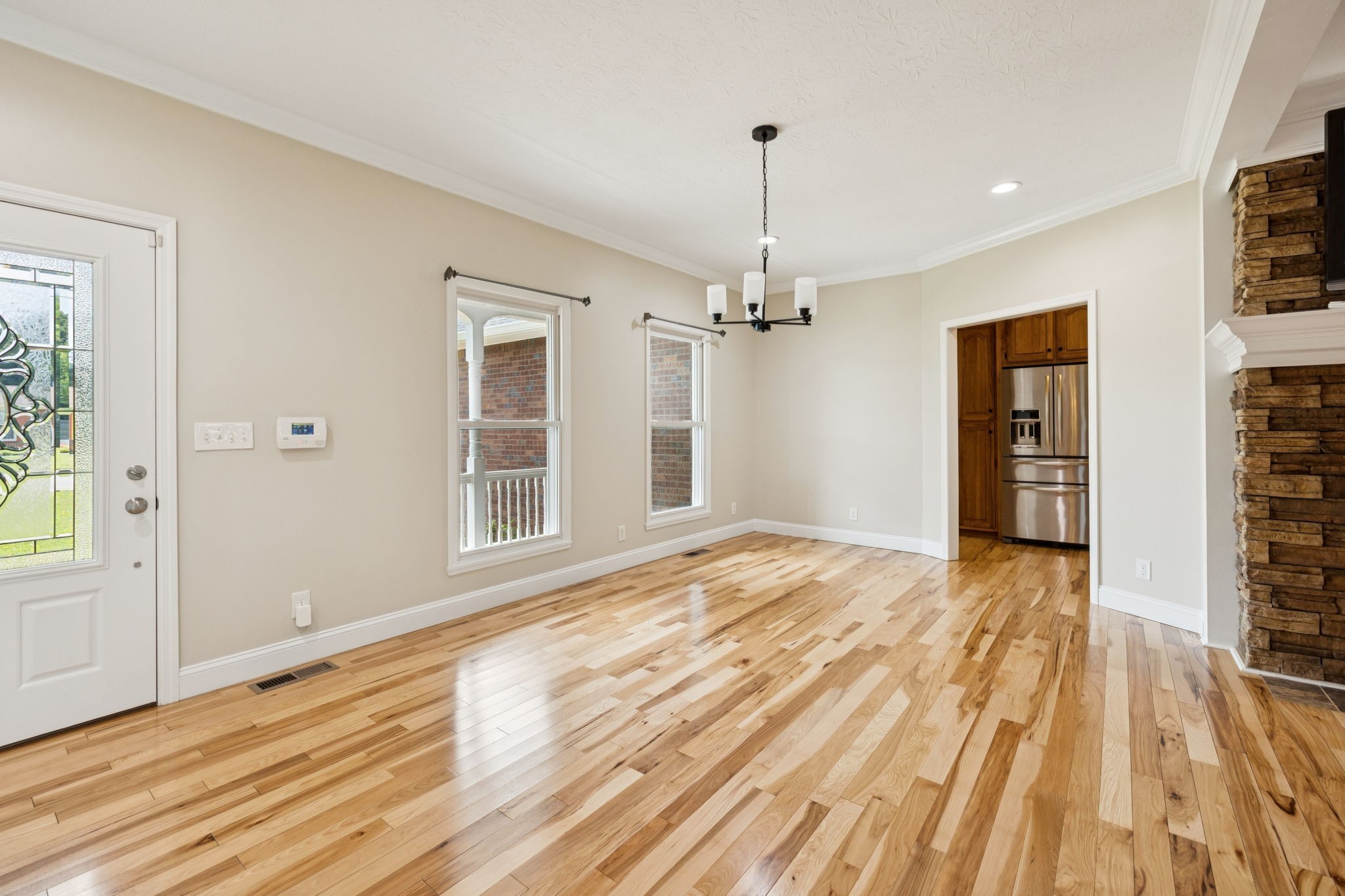 314 West Main Street Alexandria, TN 37012 - Photo 11 of 53 a view of empty room with wooden floor and fan